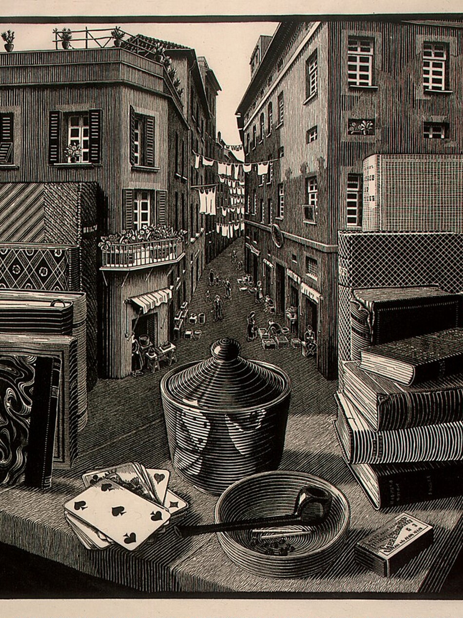 We look across the corner of a wooden table piled with books, playing cards, a pipe, matches, and a covered vessel out into an alley between two tall buildings in this square woodcut print. The scene is printed with black ink on cream-white paper. The corner of the table juts toward us, and we realize that the surface of the table seamlessly becomes the floor of the alleyway beyond. Closest to us, on the table, a pipe and two matches rest in a shallow bowl. A five of spades is face up on the pile of cards to our left, and the pipe, bowl, and cards are reflected in a vessel behind them. The vessel has ribbing or ridges around the sides and along the conical cover, radiating out from a ball-shaped handle. A box of matches sits next to the bowl, to our right. Four books are stacked in a pile to our right, against three taller standing books. Six more books, standing with their spine facing inward, are to our left. The farthest books on both sides rest against the side of the buildings that line the alley, as if the buildings were bookends. The buildings each have three or four stories lined with rectangular windows, some with shutters. There are a few retracted awnings, and lines of white laundry are strung between the buildings in the distance. The roofline of the building to our left nearly reaches the top edge of the paper, and the roof of the building to our right is cut off by that edge. People, tables, and goods, tiny in scale, line the shop openings along the bottom floors of the buildings. The numbers “3-‘37” appear in white against black in the lower left corner of the printed image, and the blocky letters “MCE” appear to the lower right. Pencil inscriptions in the margin beneath each corner of the printed image cannot be made out.
