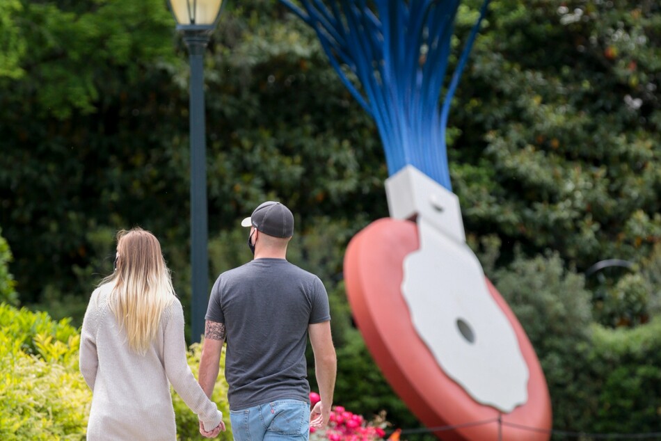 Visitors walking around and looking at art in the National Gallery's Sculpture Garden.